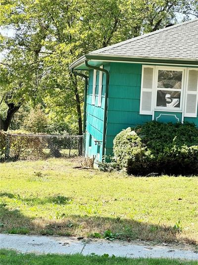 View of side of home with a lawn | Image 2