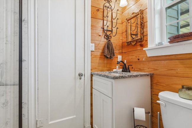 Bathroom featuring toilet and vanity | Image 27