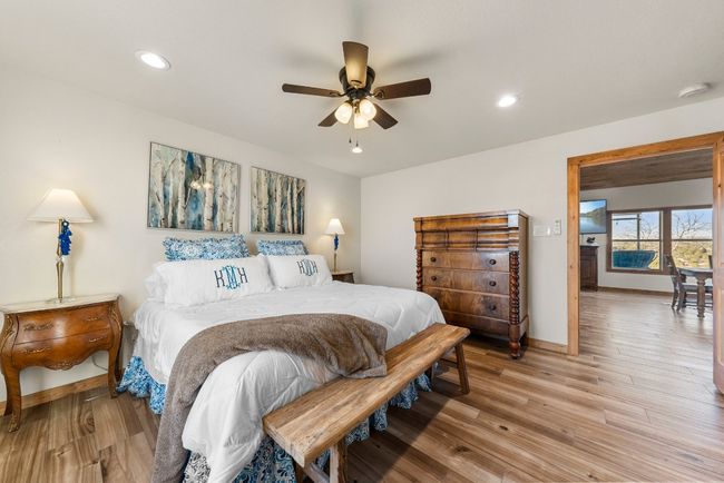Bedroom featuring light wood-style floors, recessed lighting, and baseboards | Image 21
