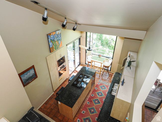 Tiled living area with track lighting | Image 25