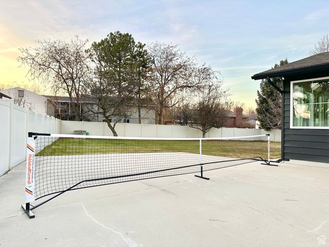 Patio terrace at dusk with a fenced backyard and a patio area | Image 43