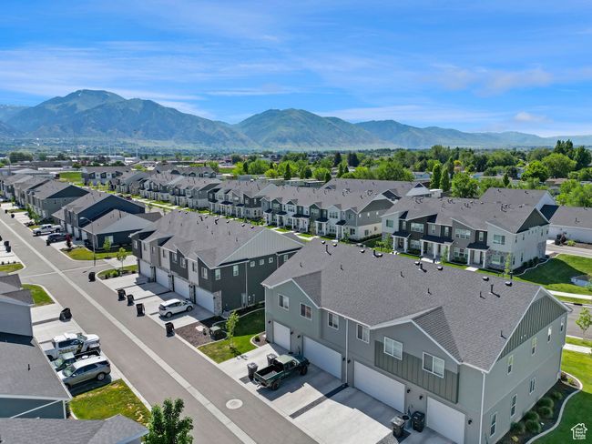 Aerial view of residential area featuring a mountainous background | Image 26