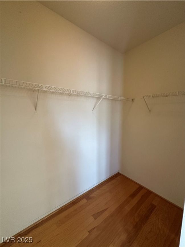 Spacious closet featuring wood finished floors | Image 18