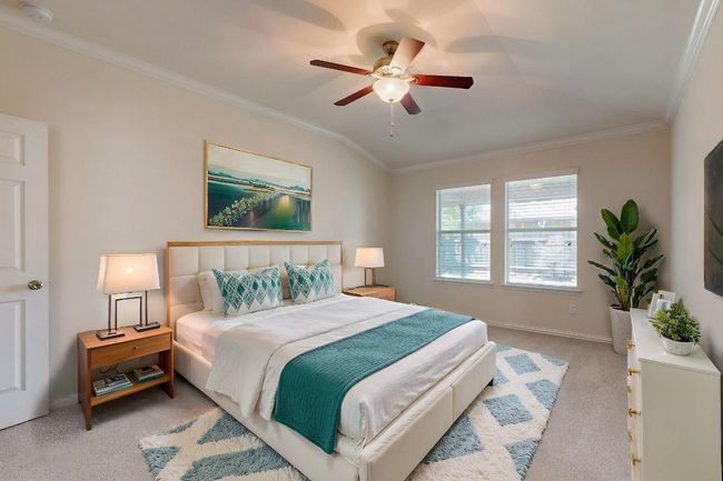 Primary bedroom is on the right side of the living space and kitchen for added privacy. Freshly painted and new carpet just installed. This is a virtually staged picture. | Image 10