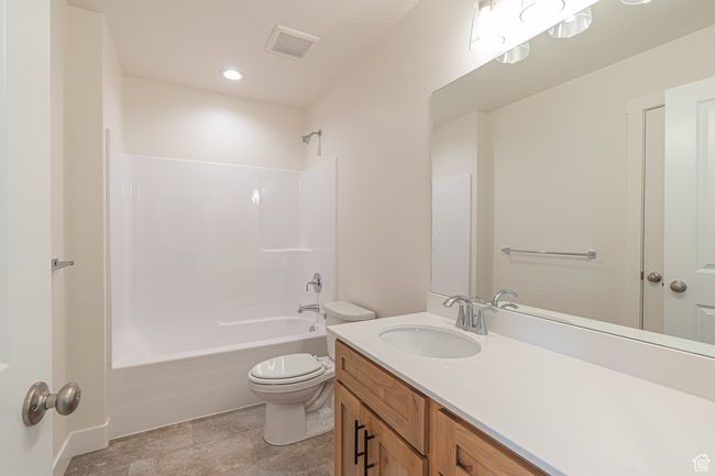 Bathroom featuring vanity, shower / tub combination, and recessed lighting | Image 15