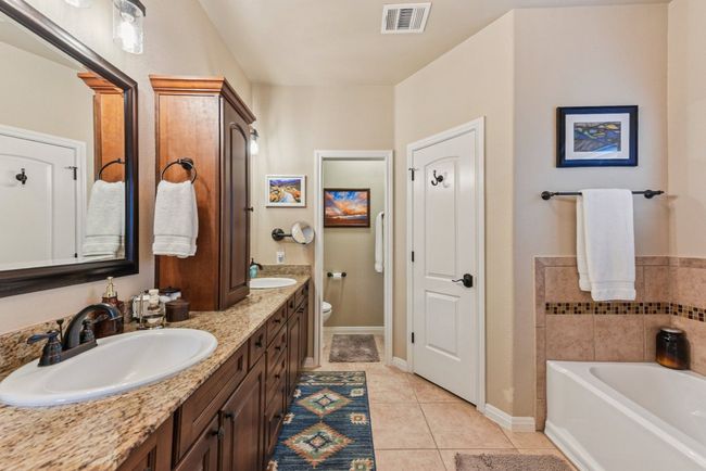 His and Hers separate closets and remodeled shower. | Image 27