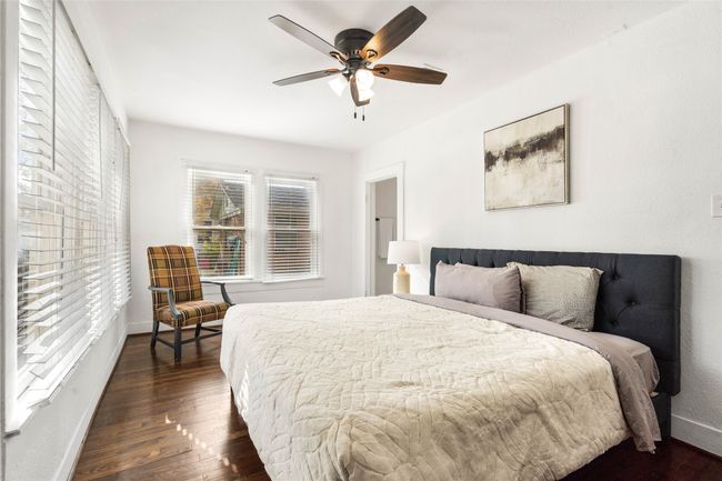 Bedroom with wood finished floors and a ceiling fan | Image 15