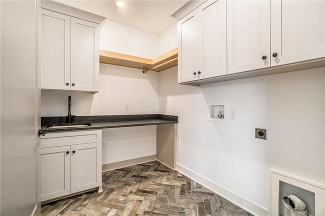 Laundry room featuring hookup for an electric dryer, washer hookup, baseboards, cabinet space, and recessed lighting | Image 29