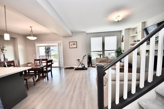 Staircase with wood finished floors and baseboards | Image 14