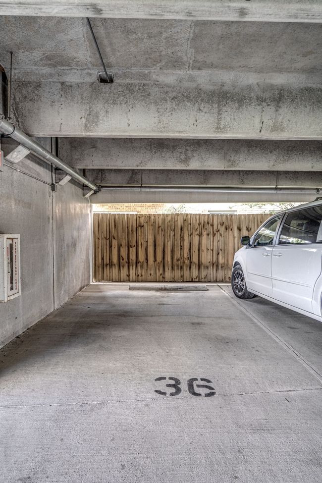 Unit 11k offers a coveted parking space, #36, situated on the main level of the covered parking garage. It's conveniently located just a few steps away from the front door, making it highly desirable for easy access. | Image 25