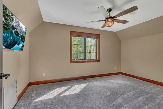 Versatile bonus room, perfect for a home theater, playroom, gym or additional living space, ready to suit your needs. | Image 73