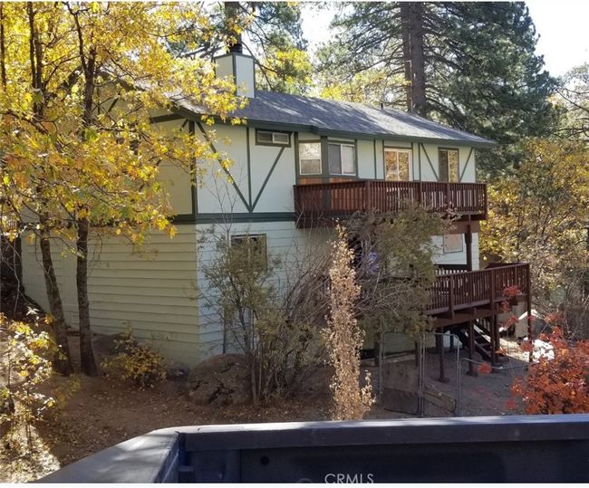 Back of home with two spacious decks fenced yard | Image 4