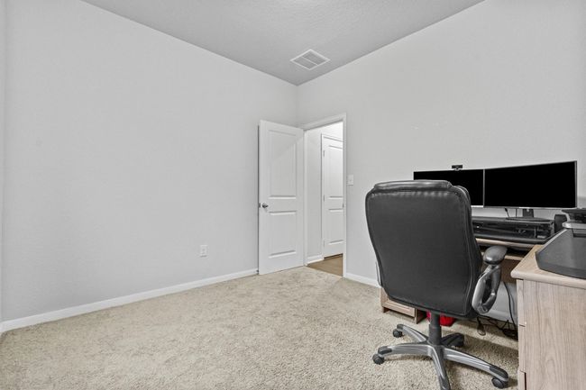 Office area with carpet floors and baseboards | Image 28