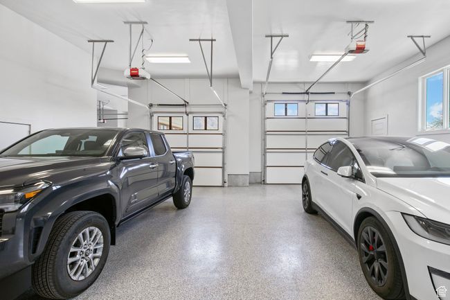 Garage featuring a garage door opener | Image 128