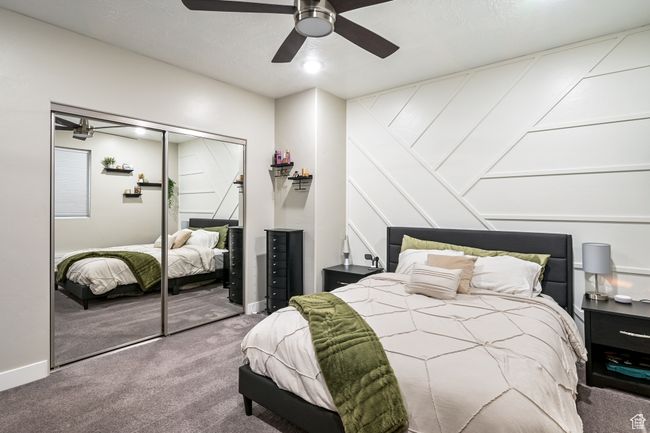 Bedroom featuring carpet, a closet, and ceiling fan | Image 72