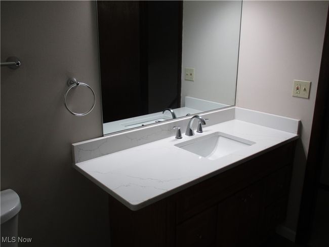 Half bathroom featuring vanity and toilet | Image 14