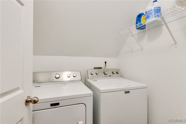 Laundry area with washer and clothes dryer | Image 24