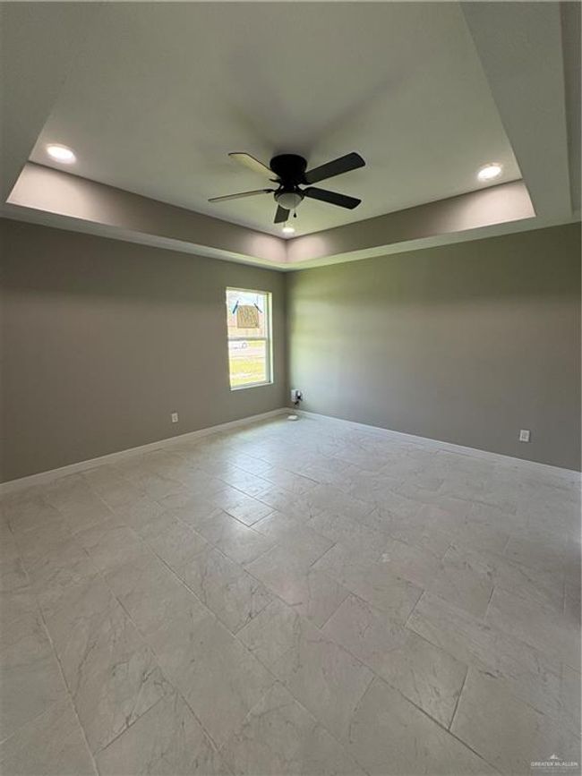 Unfurnished room with a tray ceiling, a ceiling fan, and recessed lighting | Image 11