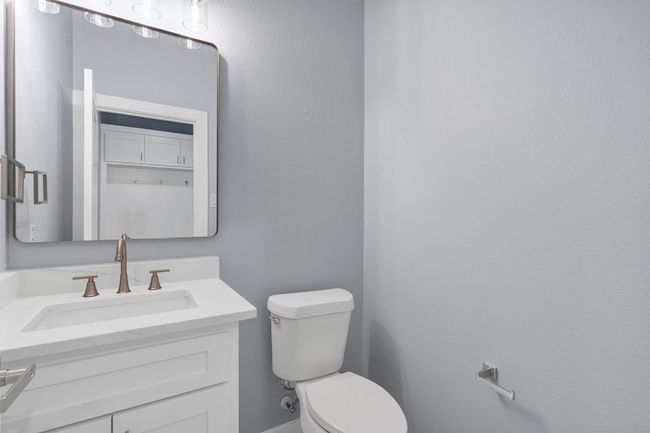 Bathroom featuring toilet and vanity | Image 18