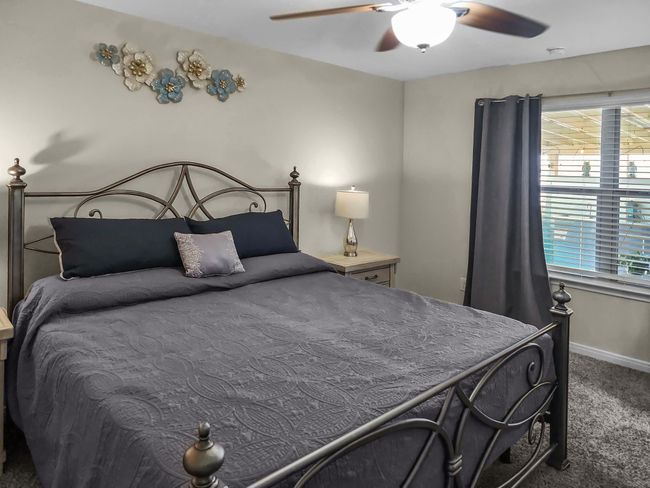 Carpeted bedroom featuring baseboards and a ceiling fan | Image 14