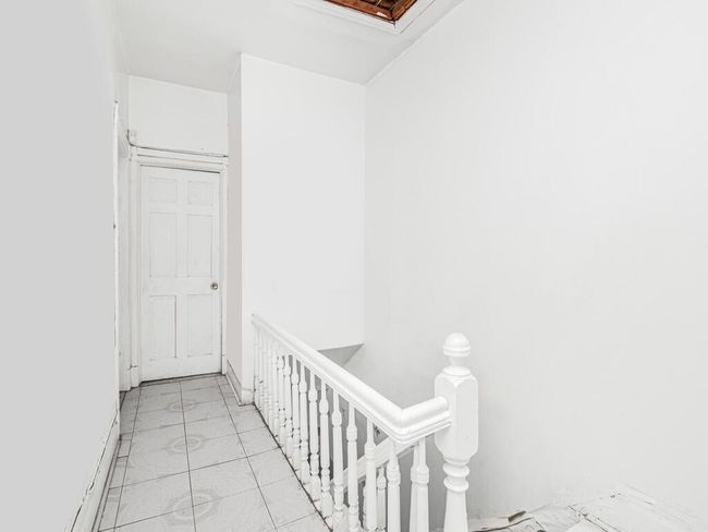 Hall with an upstairs landing and marble finish floor | Image 17