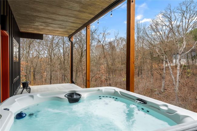 Hot tub does convey. Lower deck is covered. | Image 16