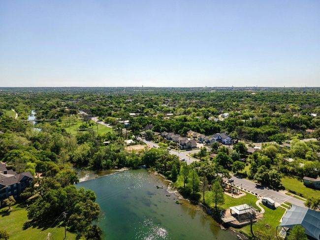 Aerial view of residential area featuring a nearby body of water | Image 5