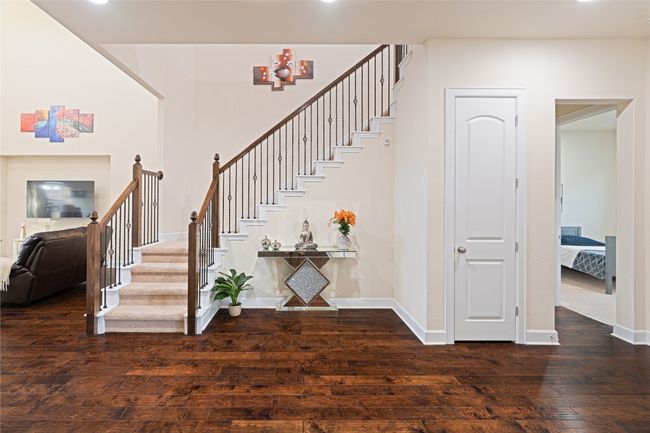 Staircase with hardwood / wood-style floors and recessed lighting | Image 9