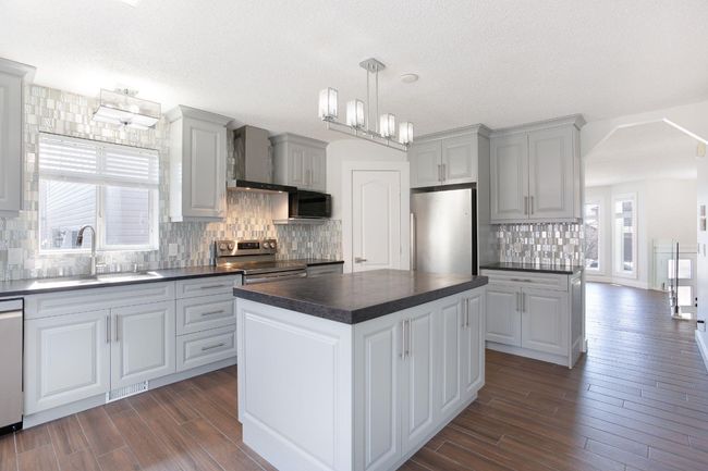 432 Rocky Ridge Drive Nw, House other with 5 bedrooms, 3 bathrooms and 4 parking in Calgary AB | Image 8