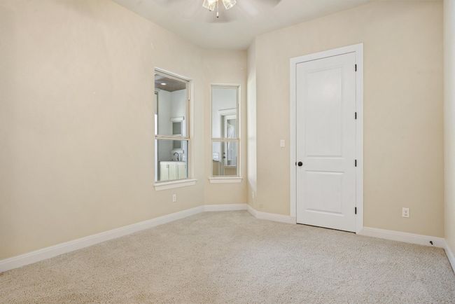 Unfurnished room featuring carpet and a ceiling fan | Image 34