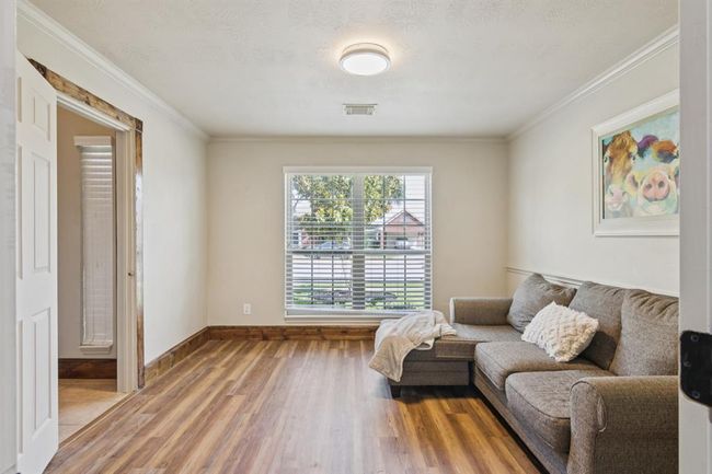 Study with beautiful floors. This room could also be used as a dining room or a sitting area. | Image 6