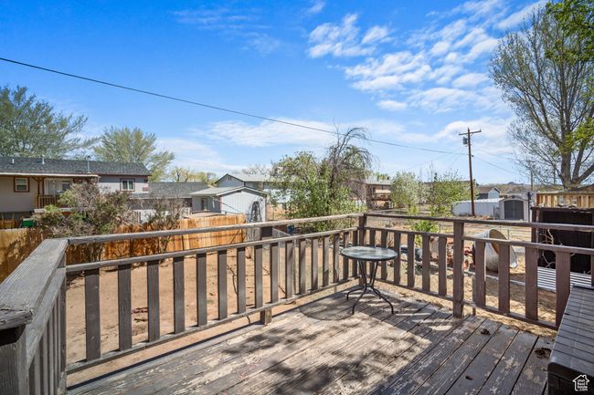 Wooden deck featuring fence private yard and a residential view | Image 22