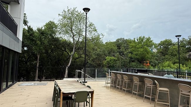 View of patio featuring a wooden deck | Image 29