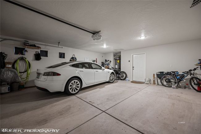 Garage featuring a garage door opener | Image 44