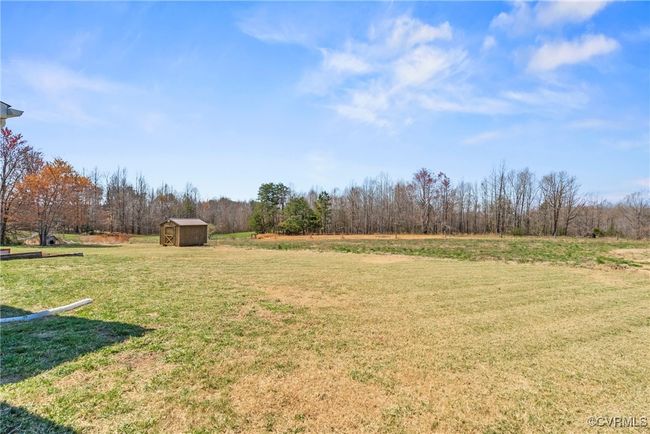 View of yard with a shed and an outbuilding | Image 5