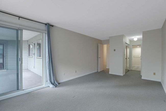 Spare room featuring carpet floors and baseboards | Image 23