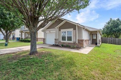 View of front of house with a garage and a front lawn | Image 2