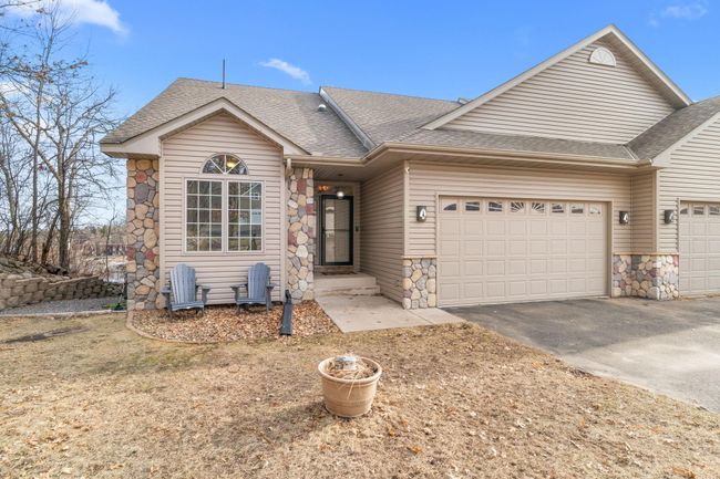 Roof 2017. Furnace/AC, tankless water heater 2023. New asphalt driveway in front of garage. Townhome garage is insulated - 460sqft. | Image 50