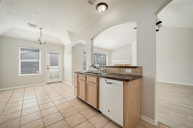 Kitchen area that overlooks the living room | Image 8