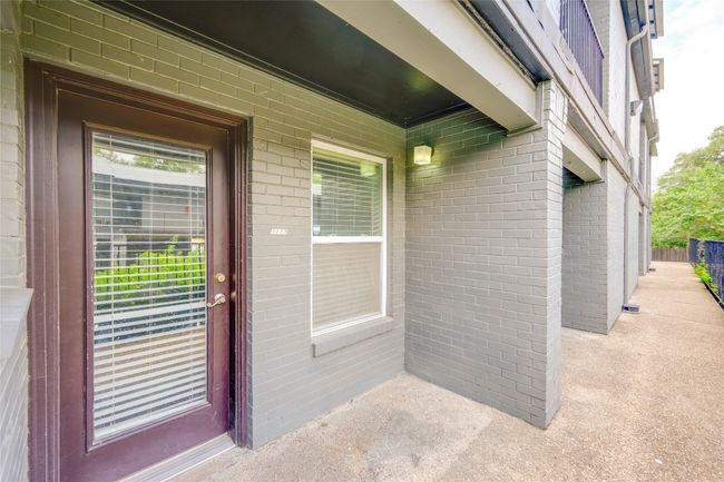 Doorway to property featuring brick siding | Image 23