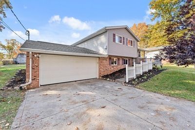 View of side of property featuring a yard | Image 1