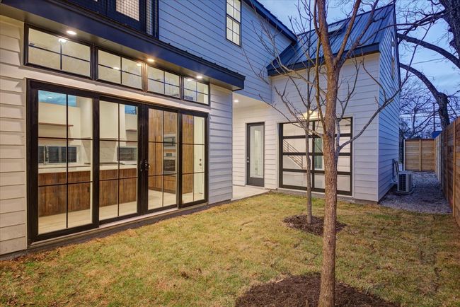This is an entertainer's dream. The home's lot offers multiple outdoor areas to entertain or enjoy yard activities. Thoughtful outdoor lighting makes this place shine at night. SEE VIRTUAL TOUR LINK WITH INTERACTIVE FLOOR PLAN AND 3D WALK THRU. | Image 6