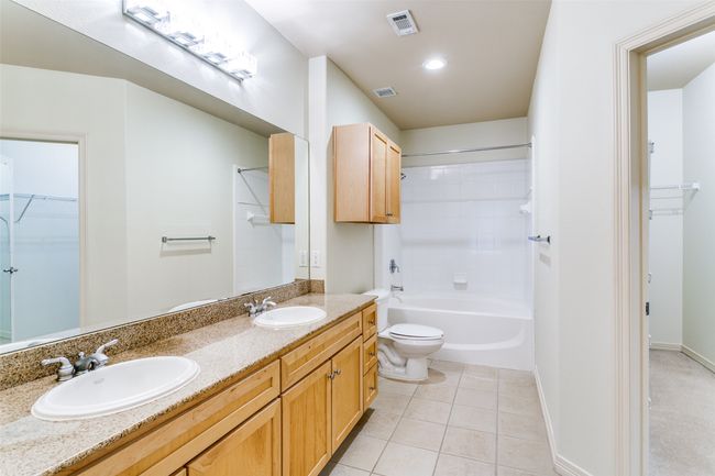 Double sinks in primary bathroom and ample storage space. | Image 9