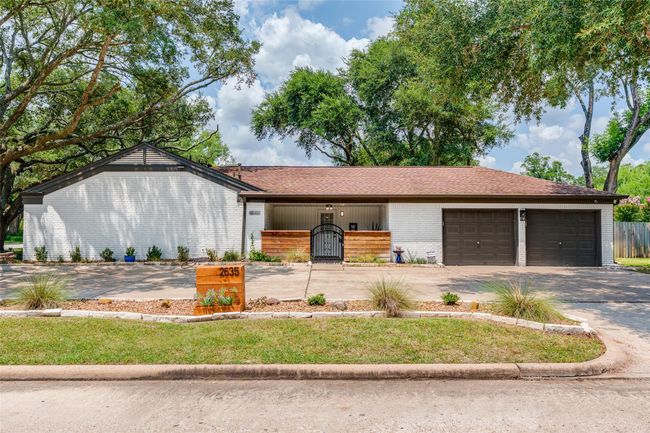 This home offers a double-wide driveway leading to an attached 2-car garage and additional parking—providing both convenience and added privacy for your everyday lifestyle | Image 20