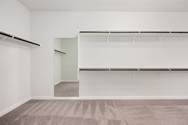 Spacious closet featuring carpet floors | Image 21
