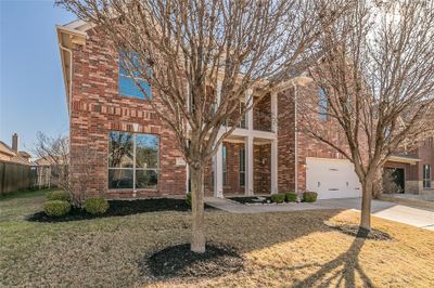 Beautifully landscaped interior lot with trees | Image 2