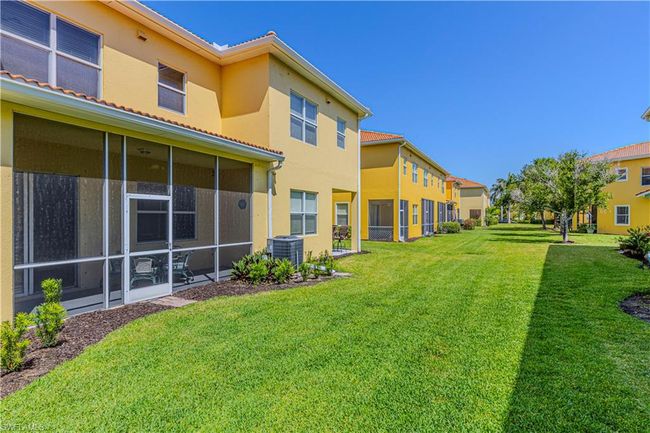 View of yard featuring cooling unit and a sunroom | Image 26
