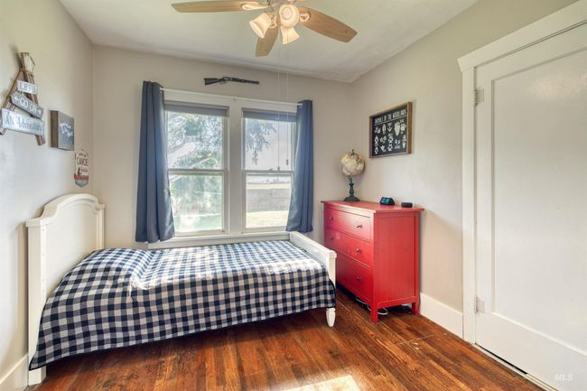 Bedroom featuring wood finished floors and a ceiling fan | Image 23
