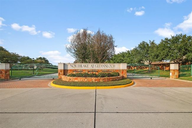 Gated entrance to Northlake at Gleannloch Farms with lake and sidewalks surrounding. | Image 41