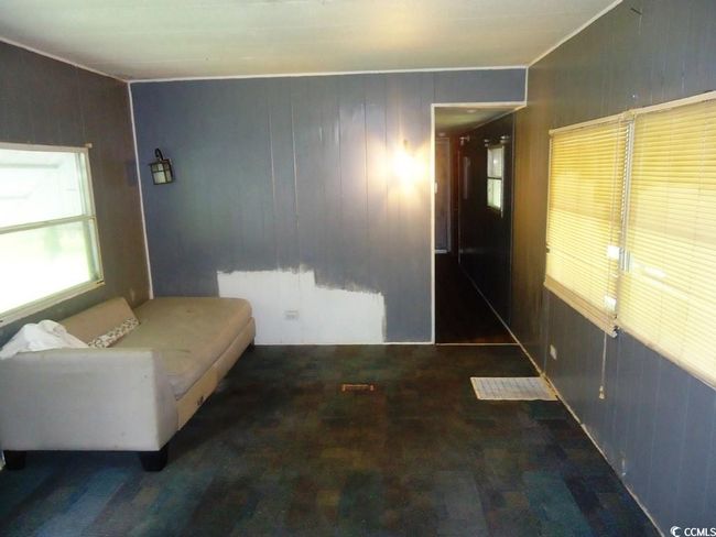 Bedroom with wood walls | Image 14